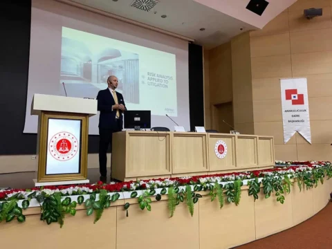 Thomas Gaultier is on stage delivering a presentation.